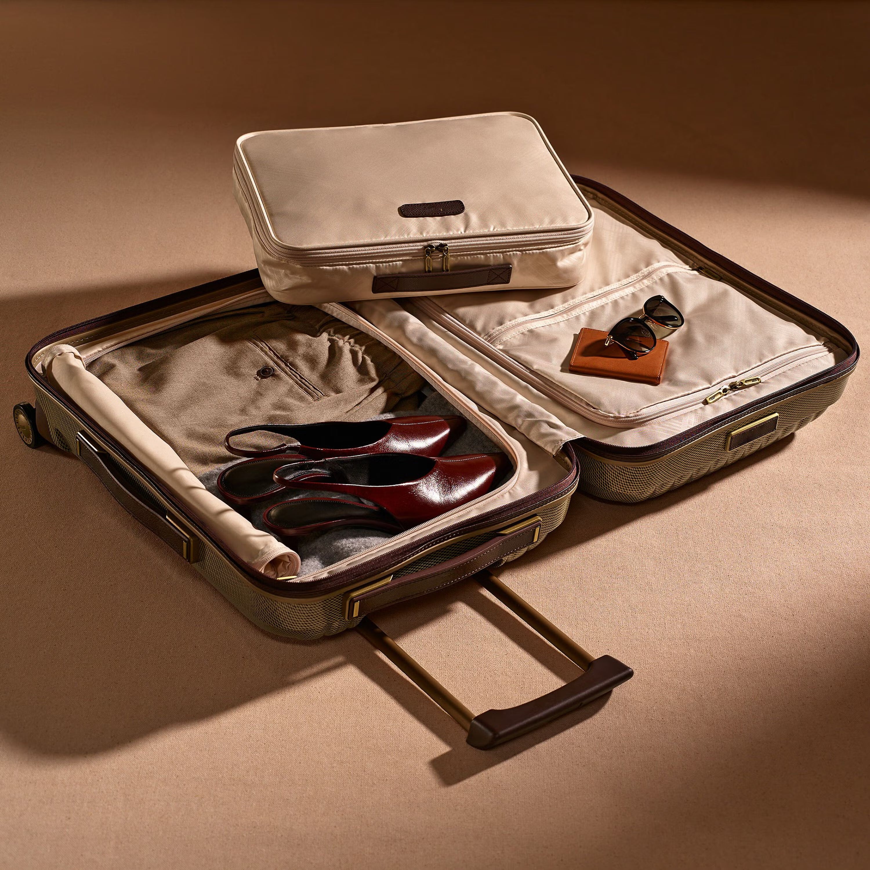Textured Neutral-Tone Carry-On Suitcase with Brown Accents and Polished Hardware