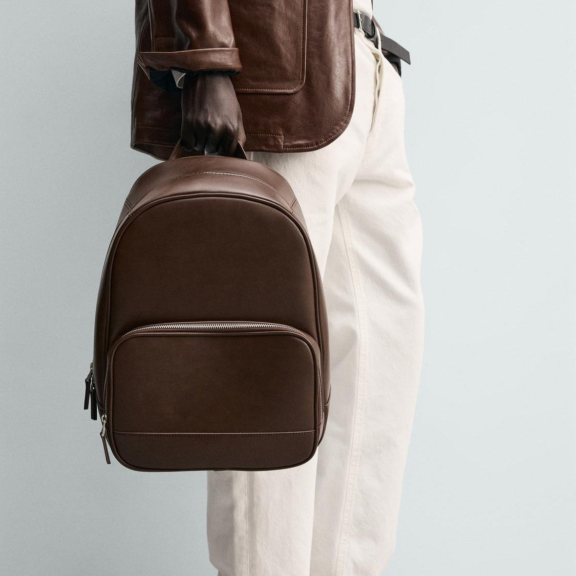 Smooth Brown Minimalist Backpack with Front Zip Pocket and Luggage Strap